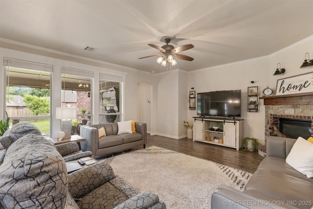 3117 S Hemlock Ct, Broken Arrow, OK 74012 - living area with a ceiling fan, wood finished floors, a fireplace, crown molding, and baseboards