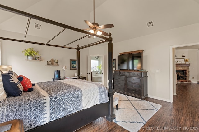 3117 S Hemlock Ct, Broken Arrow, OK 74012 - bedroom featuring wood finished floors, vaulted ceiling, baseboards, a fireplace, and a ceiling fan