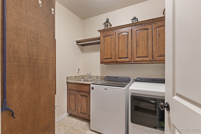 3117 S Hemlock Ct, Broken Arrow, OK 74012 - laundry room with washer and dryer, cabinet space, light tile patterned flooring, and baseboards