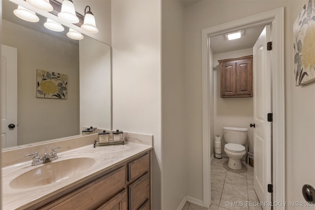 3117 S Hemlock Ct, Broken Arrow, OK 74012 - bathroom featuring toilet, vanity, baseboards, and tile patterned floors