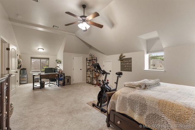 3117 S Hemlock Ct, Broken Arrow, OK 74012 - carpeted bedroom featuring a desk, multiple windows, lofted ceiling, and ceiling fan