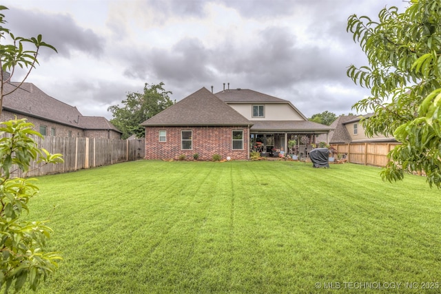 3117 S Hemlock Ct, Broken Arrow, OK 74012 - back of property featuring brick siding and a shingled roof