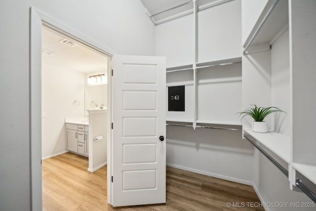 12503 N 130th Ave E, Collinsville, OK 74021 - spacious closet featuring light wood finished floors