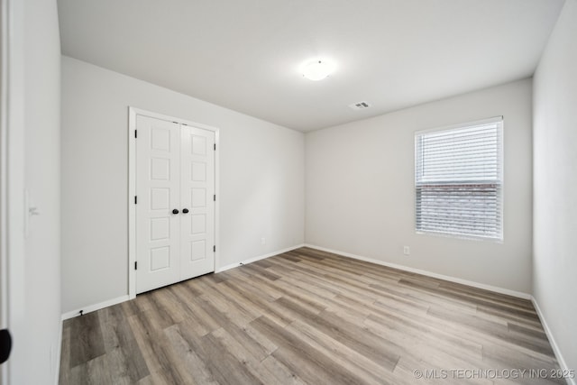 12503 N 130th Ave E, Collinsville, OK 74021 - empty room featuring wood finished floors and baseboards