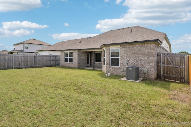 12503 N 130th Ave E, Collinsville, OK 74021 - back of property featuring cooling unit, roof with shingles, and brick siding