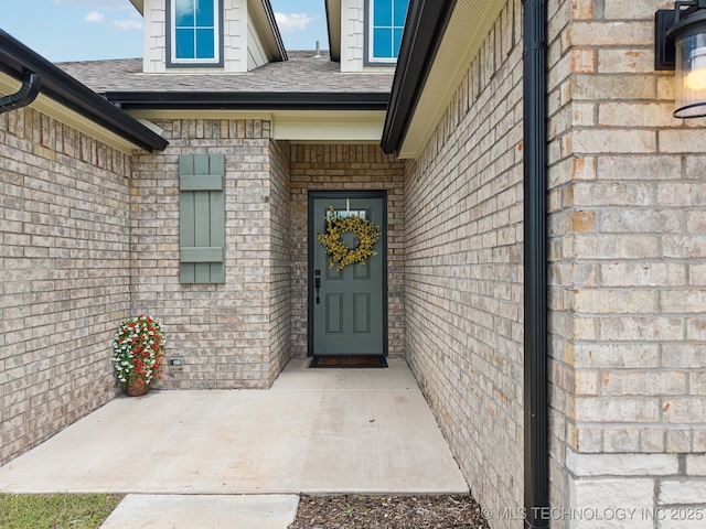 12503 N 130th Ave E, Collinsville, OK 74021 - entrance to property with a shingled roof and brick siding