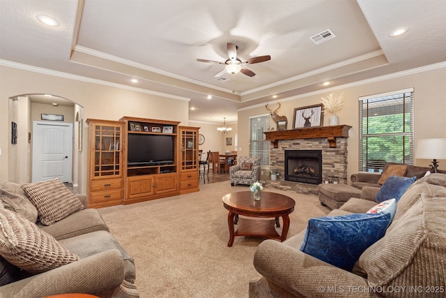 23532 N 5 Mile Rd, Fort Gibson, OK 74434 - living area featuring a tray ceiling, arched walkways, ornamental molding, light carpet, and a ceiling fan