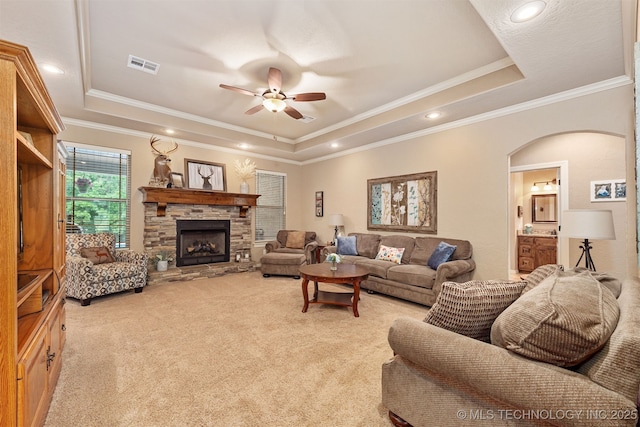23532 N 5 Mile Rd, Fort Gibson, OK 74434 - living room with a raised ceiling, a ceiling fan, light colored carpet, ornamental molding, and arched walkways