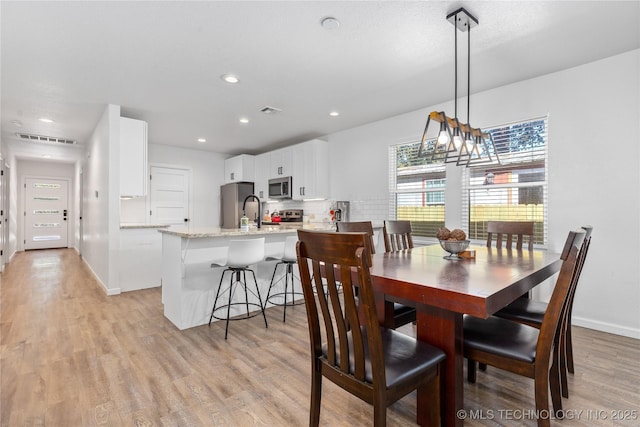 14 Missouri Dr, Afton, OK 74331 - dining room with light wood-style floors, recessed lighting, and baseboards