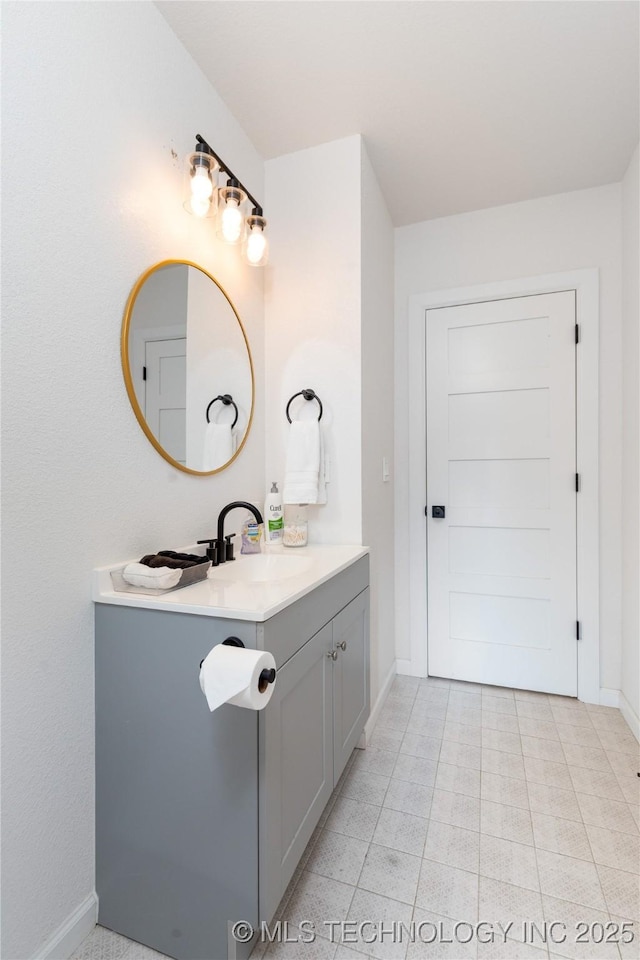 14 Missouri Dr, Afton, OK 74331 - bathroom with vanity, baseboards, and tile patterned flooring