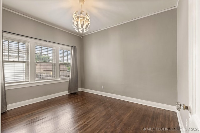 2305 E 13th St, Tulsa, OK 74104 - spare room with a chandelier, dark wood-style floors, baseboards, and crown molding