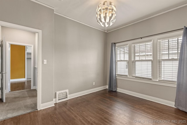 2305 E 13th St, Tulsa, OK 74104 - empty room with a chandelier, dark wood-style floors, baseboards, and ornamental molding