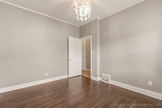 2305 E 13th St, Tulsa, OK 74104 - spare room featuring a chandelier, baseboards, ornamental molding, and dark wood-style floors