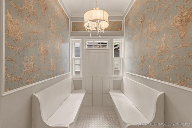 2305 E 13th St, Tulsa, OK 74104 - unfurnished room featuring a chandelier, wallpapered walls, crown molding, tile patterned flooring, and wainscoting