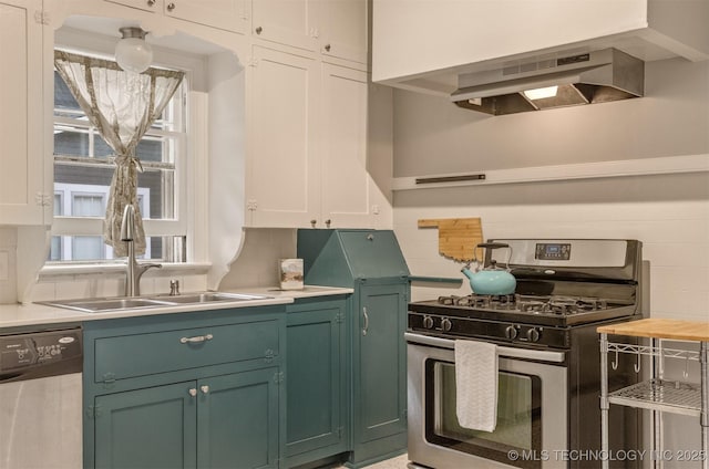 2305 E 13th St, Tulsa, OK 74104 - kitchen featuring appliances with stainless steel finishes, a sink, light countertops, and backsplash