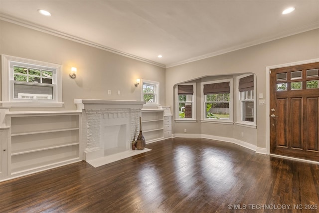 2305 E 13th St, Tulsa, OK 74104 - unfurnished living room featuring wood finished floors, a fireplace, crown molding, baseboards, and recessed lighting