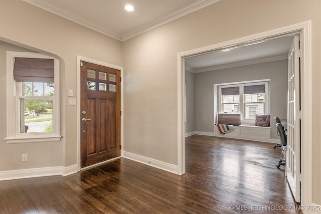 2305 E 13th St, Tulsa, OK 74104 - foyer entrance with plenty of natural light, dark wood-style floors, ornamental molding, baseboards, and arched walkways