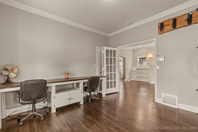 2305 E 13th St, Tulsa, OK 74104 - home office with crown molding, wood finished floors, baseboards, and built in study area