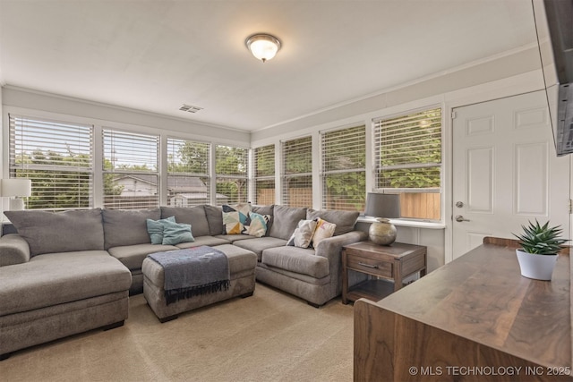2305 E 13th St, Tulsa, OK 74104 - living area featuring crown molding and light colored carpet