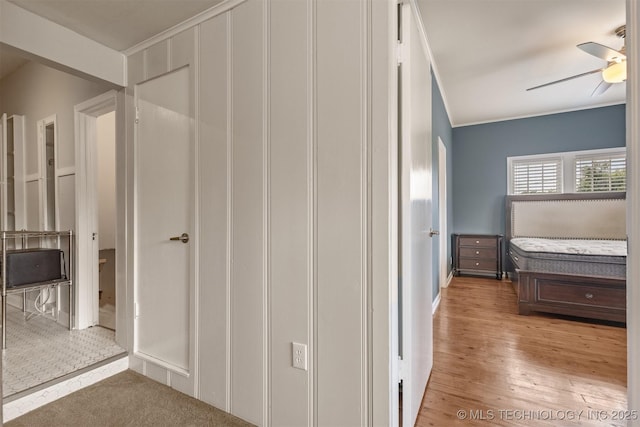 2305 E 13th St, Tulsa, OK 74104 - unfurnished bedroom with wood finished floors and ceiling fan