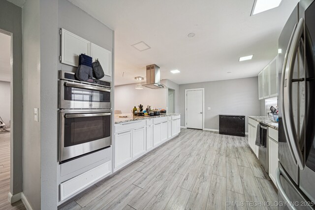 6407 S 110th E Ave, Tulsa, OK 74133 - kitchen featuring appliances with stainless steel finishes, light wood-style floors, white cabinetry, and baseboards