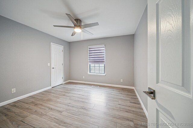 6407 S 110th E Ave, Tulsa, OK 74133 - spare room with ceiling fan, baseboards, and wood finished floors