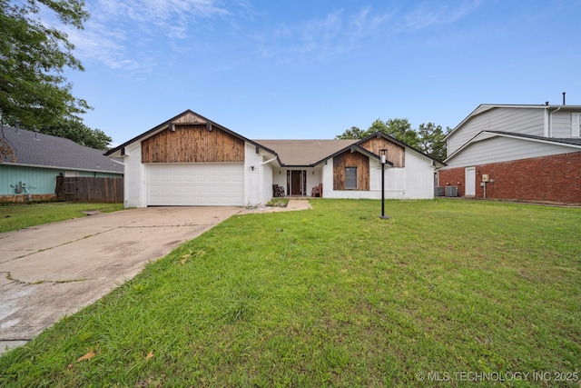 6407 S 110th E Ave, Tulsa, OK 74133 - view of front of home featuring a garage, driveway, central air condition unit, and brick siding