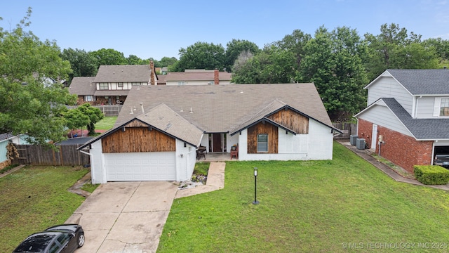 6407 S 110th E Ave, Tulsa, OK 74133 - view of front of house with cooling unit, concrete driveway, and brick siding