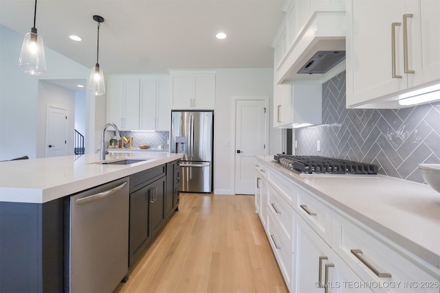 13657 S 21st Ct E, Bixby, OK 74008 - kitchen with stainless steel appliances, a sink, custom exhaust hood, light countertops, and backsplash