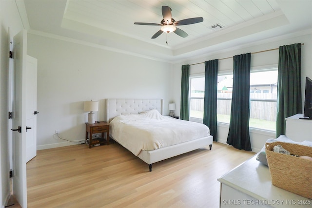 13657 S 21st Ct E, Bixby, OK 74008 - bedroom with a raised ceiling, light wood finished floors, baseboards, ceiling fan, and crown molding