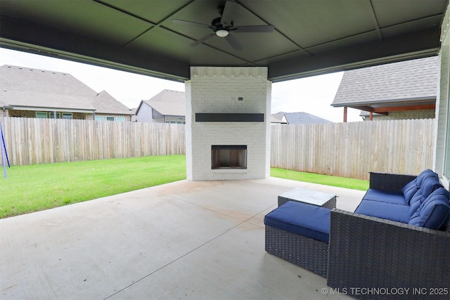 13657 S 21st Ct E, Bixby, OK 74008 - view of patio / terrace with a ceiling fan and an outdoor living space with a fireplace
