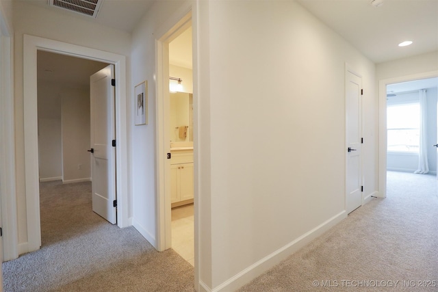 13657 S 21st Ct E, Bixby, OK 74008 - corridor featuring light carpet, baseboards, and recessed lighting