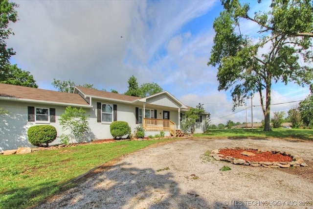 2005 Holly Rd, Claremore, OK 74017 - ranch-style home with a porch and driveway