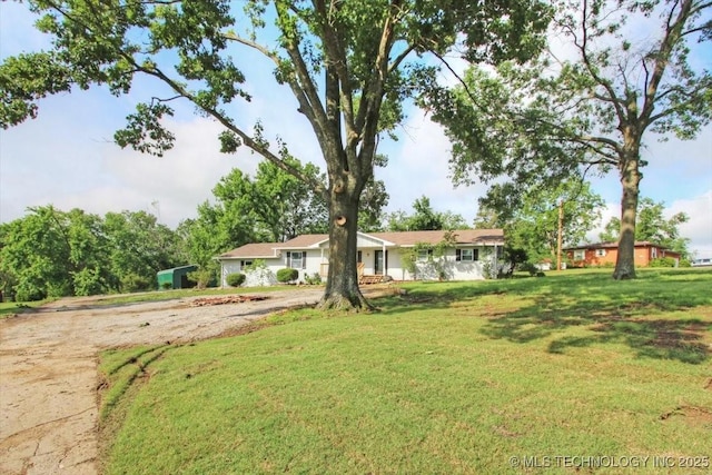 2005 Holly Rd, Claremore, OK 74017 - ranch-style house with a front lawn and driveway