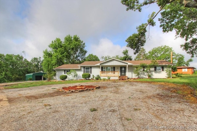 2005 Holly Rd, Claremore, OK 74017 - ranch-style home featuring a porch