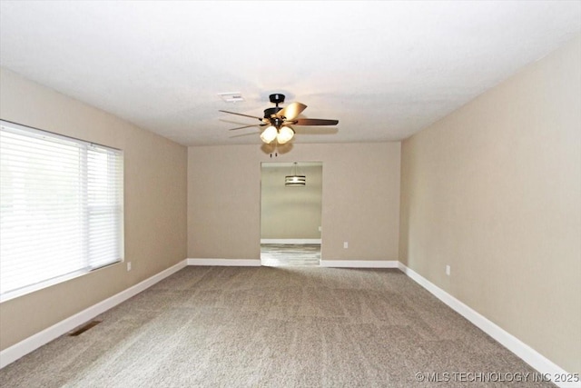 2005 Holly Rd, Claremore, OK 74017 - spare room featuring ceiling fan, carpet, and baseboards