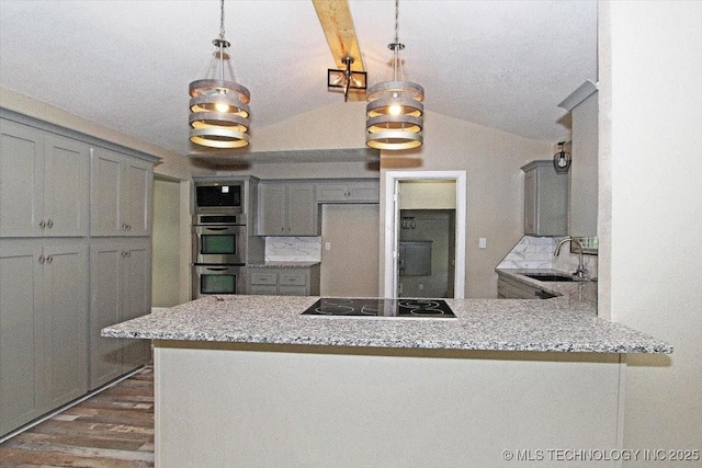 2005 Holly Rd, Claremore, OK 74017 - kitchen featuring black electric stovetop, double oven, gray cabinets, a sink, and dark wood finished floors