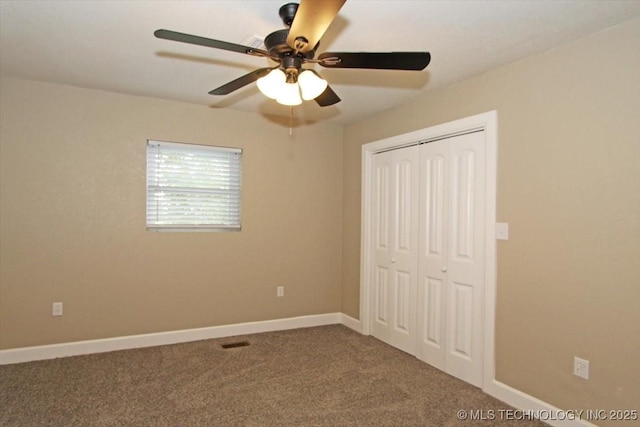 2005 Holly Rd, Claremore, OK 74017 - unfurnished bedroom with a closet, carpet flooring, baseboards, and a ceiling fan