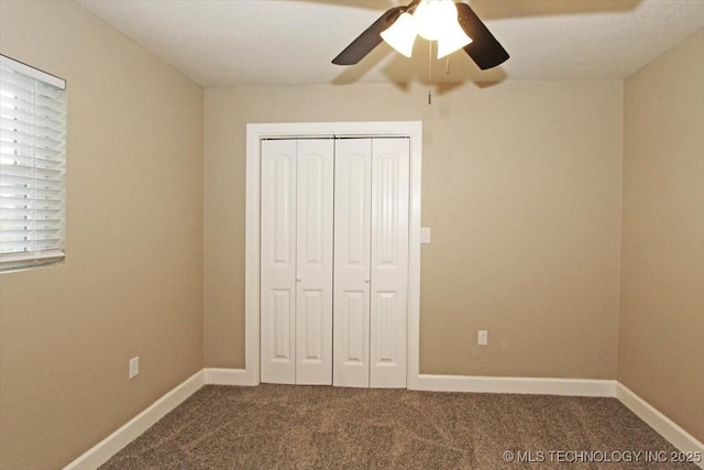 2005 Holly Rd, Claremore, OK 74017 - unfurnished bedroom featuring carpet flooring, a closet, and baseboards