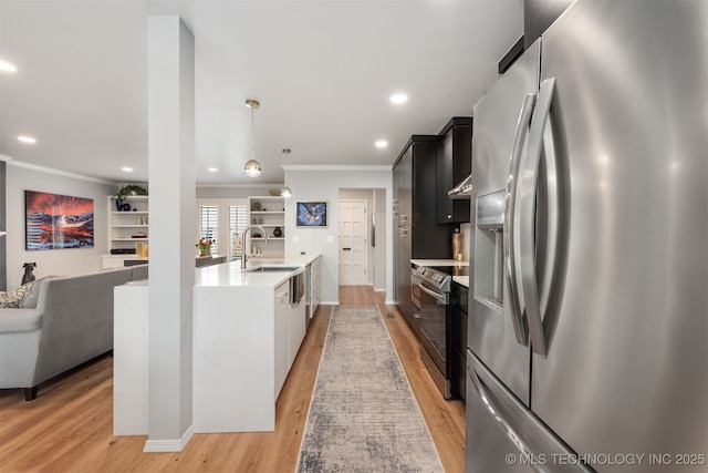 5206 S Harvard Ave Unit 308, Tulsa, OK 74135 - kitchen with stainless steel appliances, ornamental molding, light countertops, light wood-style flooring, and a sink