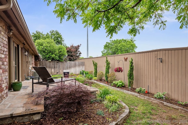 5206 S Harvard Ave Unit 308, Tulsa, OK 74135 - fenced backyard with a patio