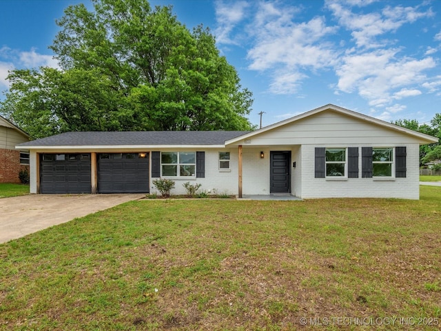 836 Crown Dr, Bartlesville, OK 74006 - ranch-style home with an attached garage, driveway, a front lawn, and brick siding