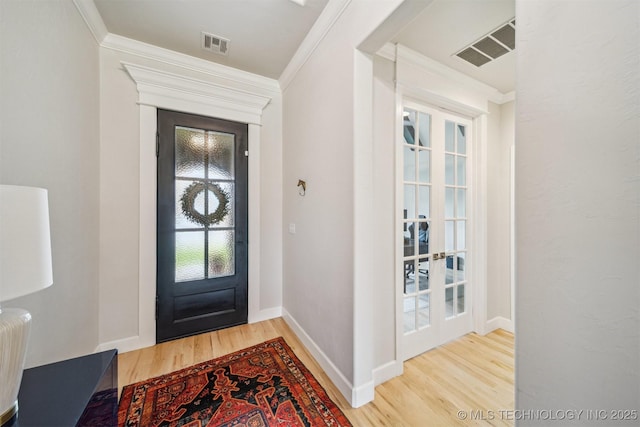 5918 E 127th Pl S, Tulsa, OK 74008 - entrance foyer featuring crown molding, wood finished floors, and baseboards