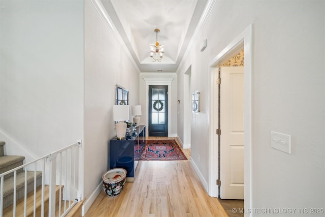 5918 E 127th Pl S, Tulsa, OK 74008 - foyer entrance featuring a chandelier, wood finished floors, stairway, ornamental molding, and baseboards
