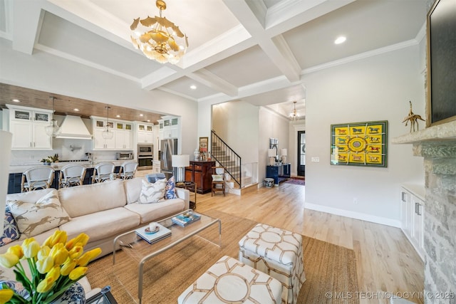 5918 E 127th Pl S, Tulsa, OK 74008 - living area featuring a chandelier, light wood-style flooring, beam ceiling, stairs, and coffered ceiling