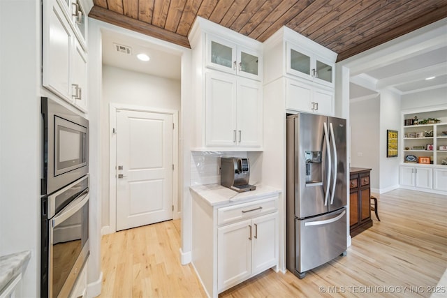5918 E 127th Pl S, Tulsa, OK 74008 - kitchen with appliances with stainless steel finishes, wood ceiling, light wood-style flooring, white cabinetry, and glass insert cabinets