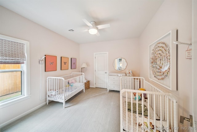 5918 E 127th Pl S, Tulsa, OK 74008 - bedroom with carpet floors, baseboards, ceiling fan, and a crib