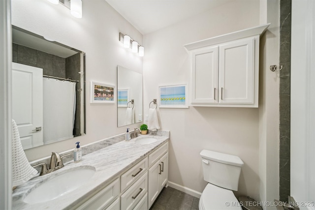 5918 E 127th Pl S, Tulsa, OK 74008 - full bathroom with double vanity, toilet, and baseboards