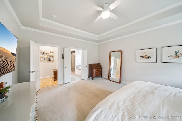 5918 E 127th Pl S, Tulsa, OK 74008 - bedroom featuring a tray ceiling, crown molding, baseboards, and ensuite bathroom