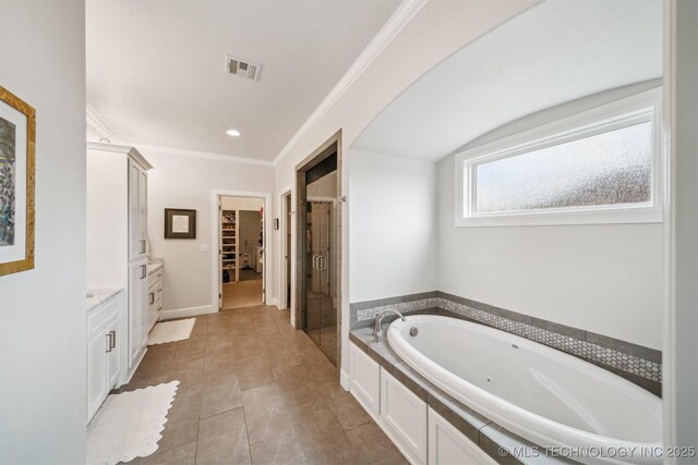 5918 E 127th Pl S, Tulsa, OK 74008 - full bathroom featuring a tub with jets, a spacious closet, a stall shower, vanity, and crown molding